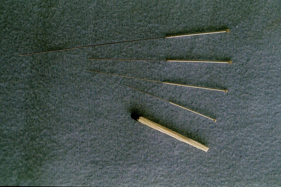 Close-up of acupuncture needles on a treatment tray