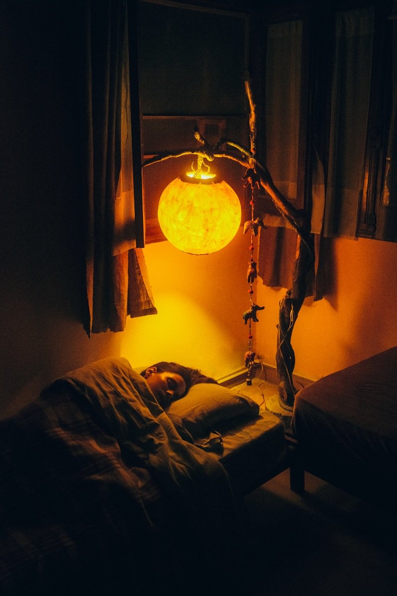 Person sleeping in bed with CPAP mask